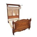 A nineteenth century mahogany half-tester double bed, the back with square tapering cornerposts