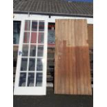 A painted glazed door with sixteen bevelled glass panes in moulded frames - 28.75in x 80.5in; and