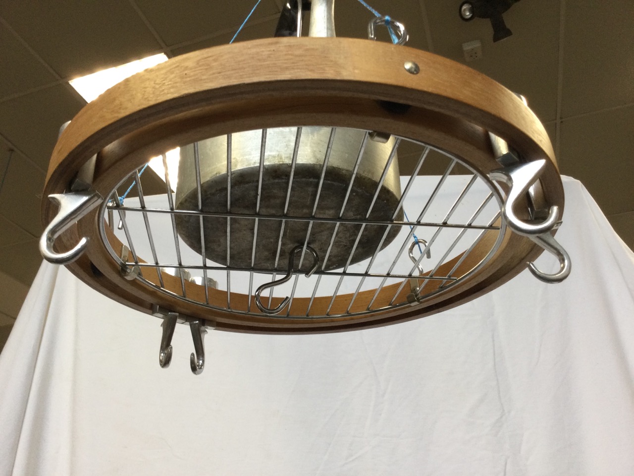 A contemporary kitchen utensil hanger with circular grill tray with revolving hooks; and an - Image 3 of 3