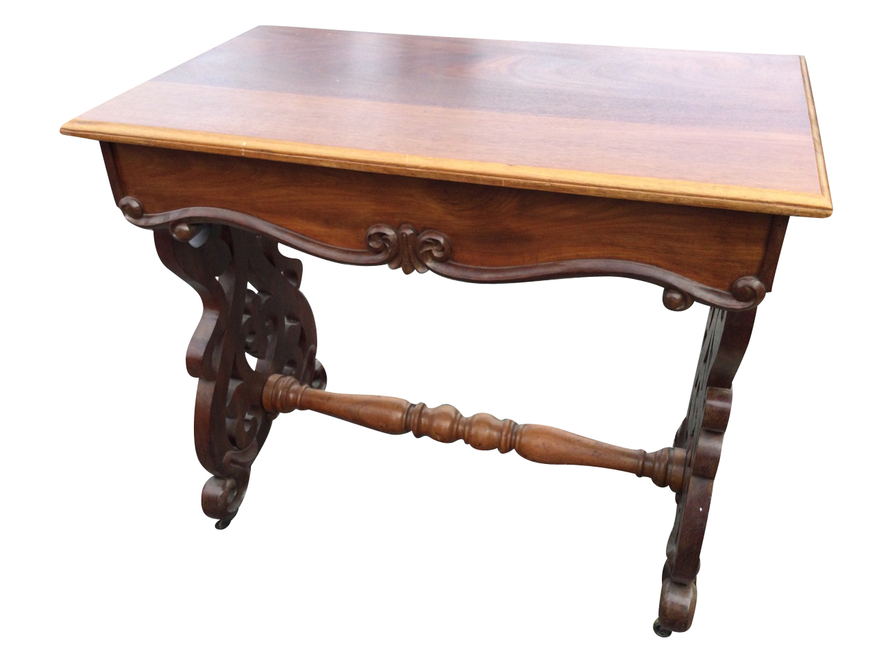 A nineteenth century mahogany occasional table with rectangular moulded top above scroll carved