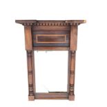 A nineteenth century mahogany pier glass with breakfront cornice above beading, having rosewood