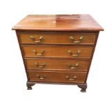 A Georgian style mahogany chest of drawers with rectangular moulded top above four long cockbeaded