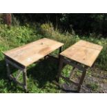 A pair of rectangular deal trestle tables with plank tops on folding legs. (53.5in x 27in x 29.75in)