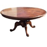 A large circular Victorian mahogany breakfast table, the moulded top supported on bulbous turned