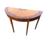 A D-shaped mahogany hall table, the top with inlaid fan decoration having walnut crossbanding,