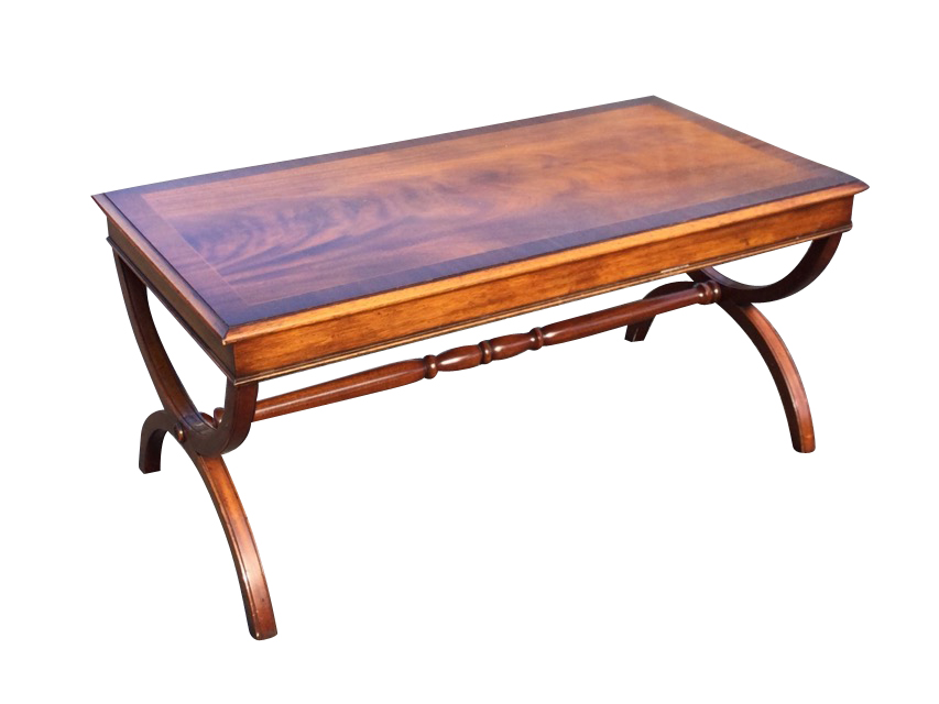 A rectangular mahogany coffee table, the crossbanded moulded top with plain apron raised on cradle
