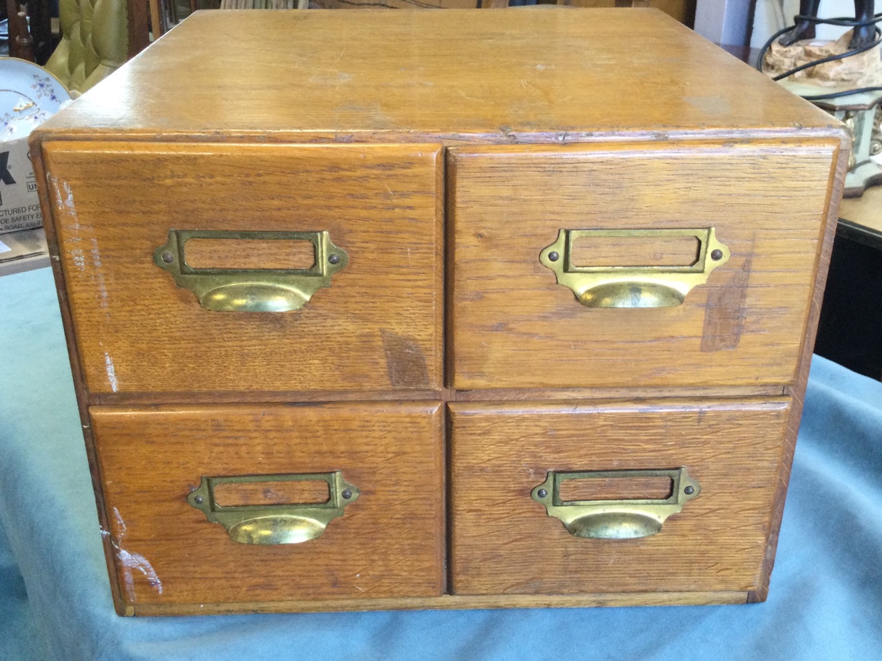 An Edwardian oak card index cabinet, with four drawers mounted with brass cup handles and label- - Image 2 of 3