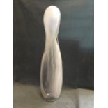 A Rene Roubicek upright figure, the opaque glass encased in clear, and with etched signature.