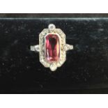 A belle epoché style ruby and diamond cluster ring set on an 18ct white gold band, the bezel set