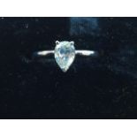 An 18ct platinum diamond ring, claw set with single pear shaped diamond weighing almost a full carat