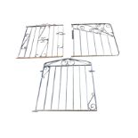 Three single wrought iron garden gates having vertical spindles with scrolled decoration. (32in) (