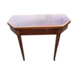 A nineteenth century mahogany turn-over-top tea table, the twin rectangular canted tops with