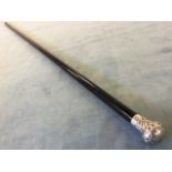 A Victorian ebonised walking cane with hallmarked silver foliate scroll embossed knop -