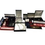 Twenty boxed & cased sets of contemporary jewellery, watch sets, pendants with earrings, lockets,