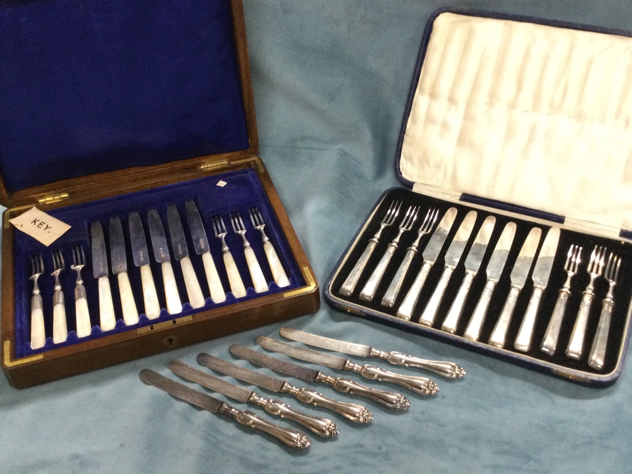 An oak cased hallmarked silver desert set with mother-of-pearl handles - Sheffield; another six-