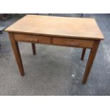 A George VI oak writing desk with rectangular top above two frieze drawers, raised on square