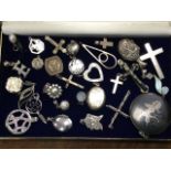 Twenty-six silver pendants, some contemporary, crucifixes, Asian neilo enamelled on silver, lockets,