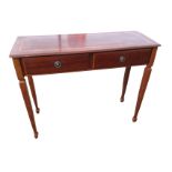 A rectangular mahogany side table, the crossbanded moulded top above two frieze drawers mounted with