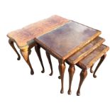 A rectangular burr walnut coffee table with plate glass shaped top having chisel carved edge, raised