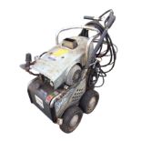 A Stella diesel powered hot jet-wash pressure washer machine on four-wheel trolley.