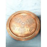 An eastern copper tray set with silvered decoration, having central star framed by trefoil