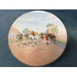 A Royal Doulton handpainted plaque after Charles Simpson, titled The Meet, with hunt on village