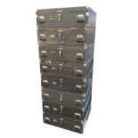 A set of eight stacking military painted kit boxes with iron mounts and carriage handles, raised