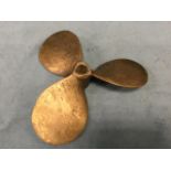 A brass ships propeller with three oval blades - unmarked. (14.5in)