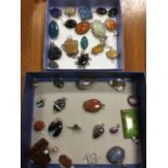 A collection of polished semi-precious stone pendants in silver mounts - agate, pebbles, mother-of-