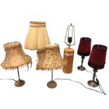 A pair of contemporary tablelamps with lustre metal columns and tubular fringed velvet shades;