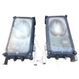 A pair of Philips industrial floodlights in rectangular rounded cases, mounted with triangular