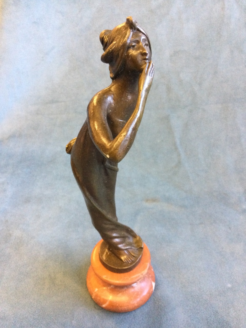 Bronze, art nouveau style lady blowing a kiss, raised on rouge marble socle - unsigned. (8.75in)