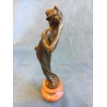 Bronze, art nouveau style lady blowing a kiss, raised on rouge marble socle - unsigned. (8.75in)
