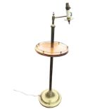 A circular mahogany lamp table with telescopic brass column having hinged adjustable arm holding