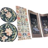 A pair of finely sewn Chinese panels with gilt and coloured threads depicting vases of flowers,