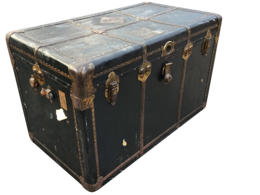 A rectangular Edwardian cabin trunk with brass mounts having studded strap bindings, with leather