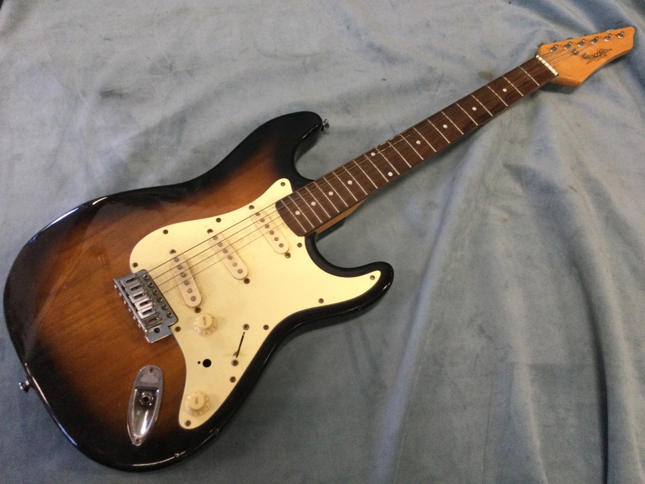 A Liberty 303 electric guitar with three pic-ups. (39.5in)