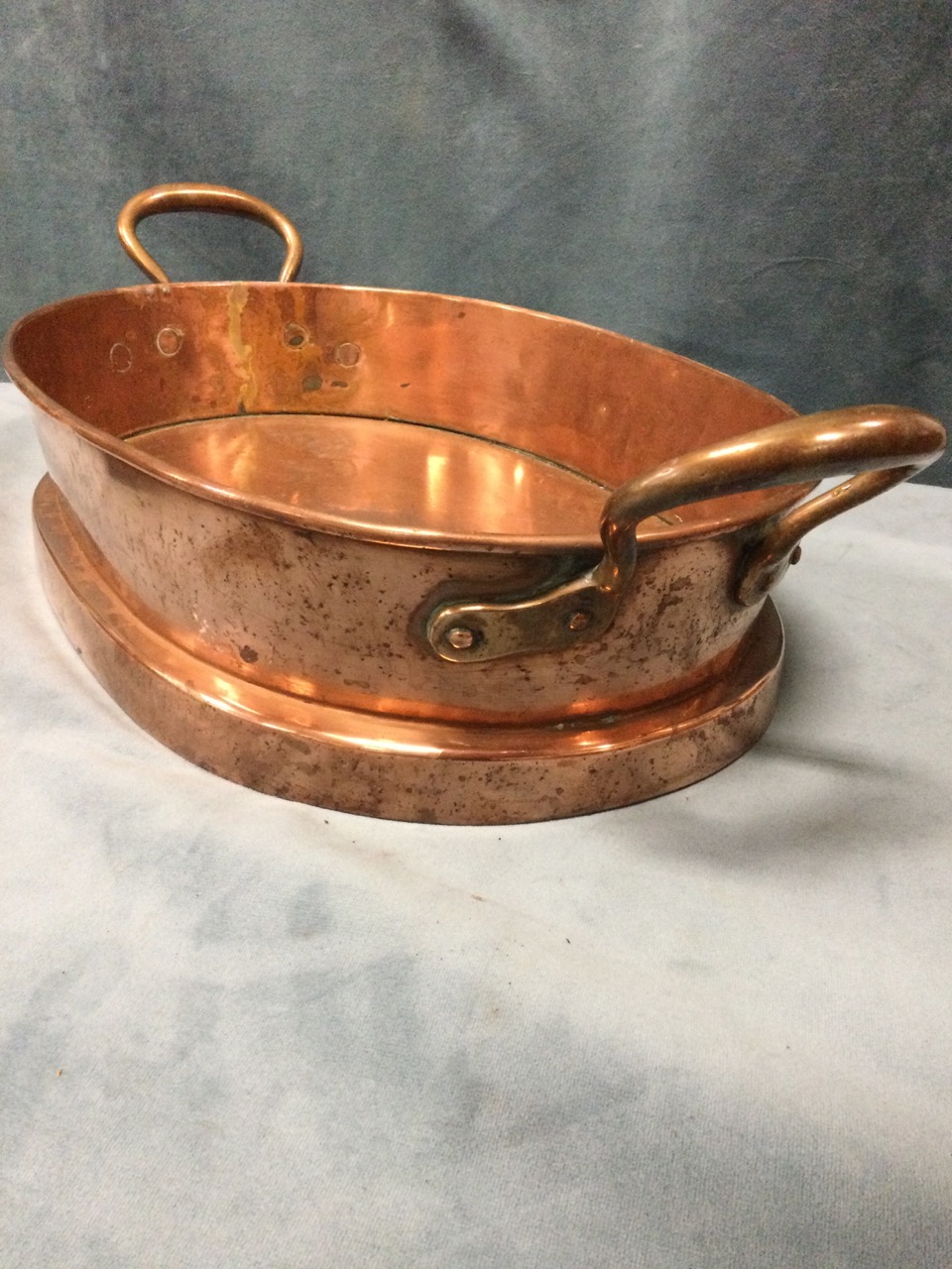 An oval copper nineteenth century ban marie with riveted handles; a brass column candlestick with - Image 2 of 3