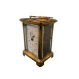 A Duverdrey & Bloquel French brass carriage clock in architectural style case surmounted by swing