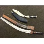 A kukri knife in leather sheath with horn studded handle having oval pommel; and a North African