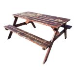 A rectangular garden table and bench set with slatted top on angled supports, the crossbars