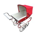 A Silver Cross pram with lined steel body and canvas concertina hood, on sprung frame with spoked