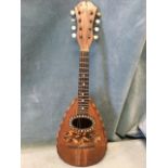 A nineteenth century Italian rosewood mandolin by Stridente, the bowl shaped body inlaid with