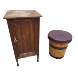 An Edwardian walnut pot cupboard with moulded top above a reeded panelled door, raised on turned