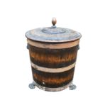 An oak barrel log bin with turned handle to cover, the staves bound by riveted bands, raised on