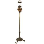 A Victorian copper oil lamp on telescopic brass column stand, with circular fluted weighted base