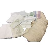 Miscellaneous textiles including bedspreads, damask tablecloths, linen dressing table mats, napkins,