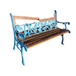 A cast iron garden bench with rectangular pierced floral panel to back, with slatted wood seat