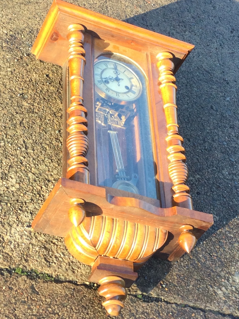 A Victorian walnut cased Vienna wallclock with moulded cornice above an arched glazed door flanked - Image 3 of 3