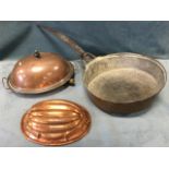 An oval ribbed copper jelly mould; a Victorian copper food warming plate with domed cover, the water
